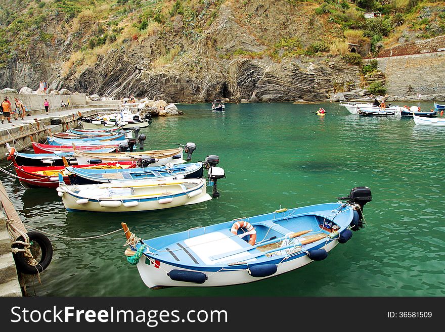 Coast and colored fishing boats of Vernazza in Italy. Coast and colored fishing boats of Vernazza in Italy