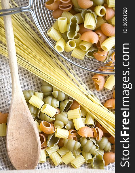 Uncooked pasta and spaghetti with kitchenware