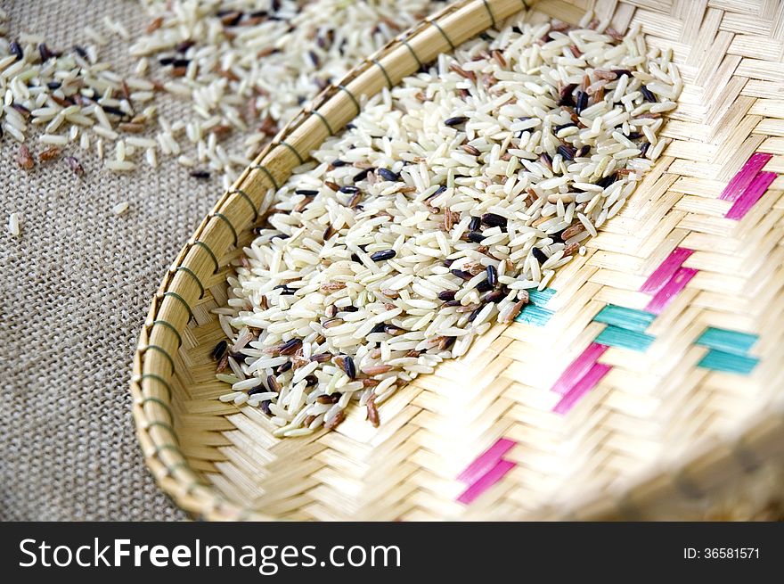 Close up raw brown rice in basket