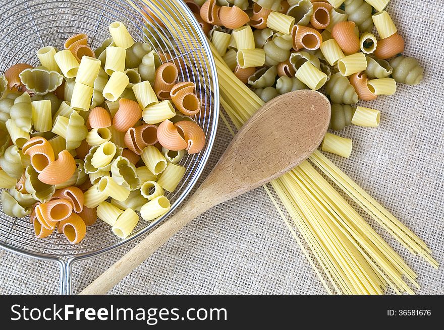 Uncooked Pasta With Wooden Spoon