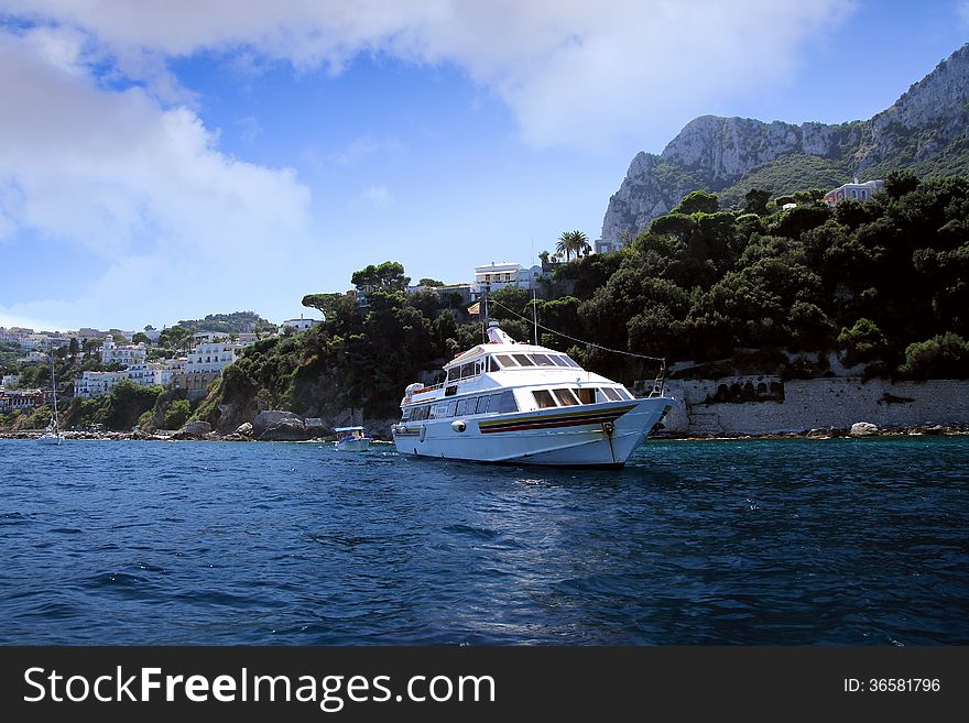 Yacht anchored in the north coast of Capri island in Italy. Yacht anchored in the north coast of Capri island in Italy