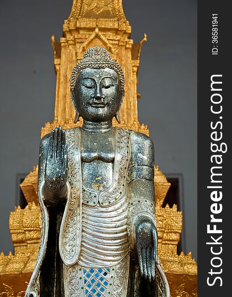 The Metal Standing Buddha With Golden Pagoda In The Temple In Th