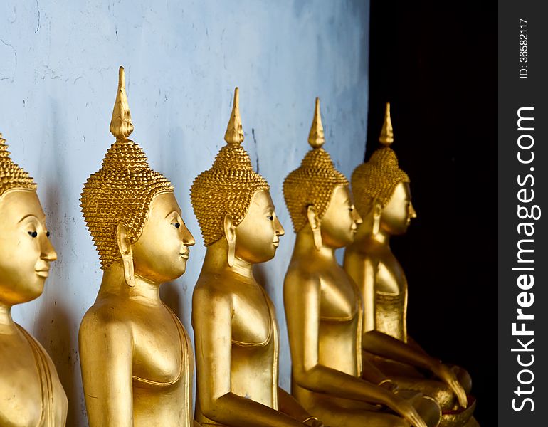 Thesitting golden Buddha at Yai Suwannaram temple in Petchaburi, Thailand. Thesitting golden Buddha at Yai Suwannaram temple in Petchaburi, Thailand