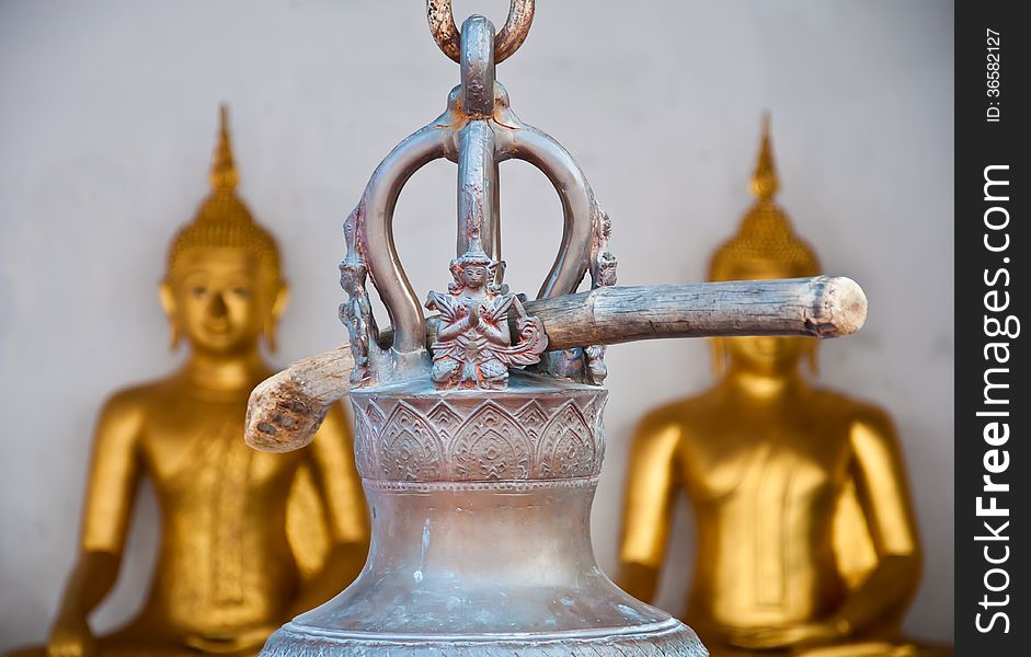 The wooden stick hange on the thai style bell in the temple in T