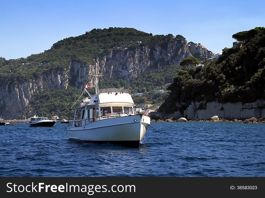 Yacht anchored in the north coast of Capri island in Italy. Yacht anchored in the north coast of Capri island in Italy