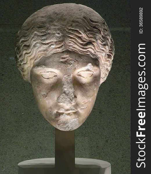 Marble head illuminated at museum