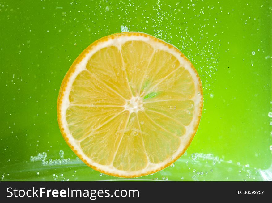 Glass citrus squeezer with lemons and juice