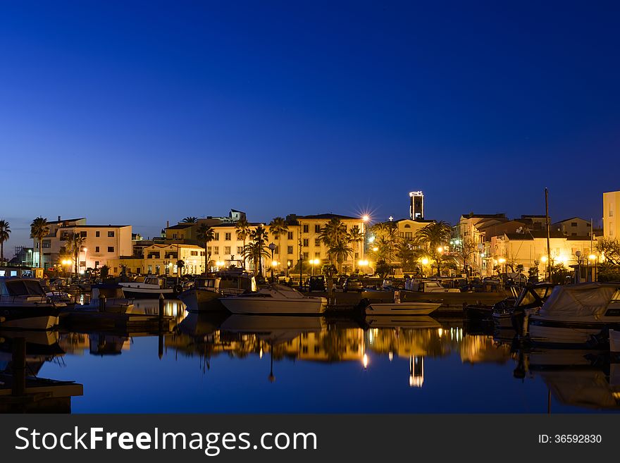 Sunset in the port of portoscuso in the south west coast of Sardinia. Sunset in the port of portoscuso in the south west coast of Sardinia.