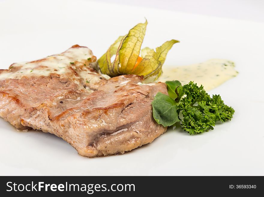 Big and juicy piece of Bavarian roasted pork in a classic, authentic beer, white sauce. served with parsley and fezalis. Big and juicy piece of Bavarian roasted pork in a classic, authentic beer, white sauce. served with parsley and fezalis