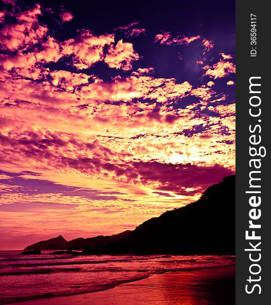 Dramatic Tropical Sunset at Lopes Mendes Beach, Ilha Grande Island, Rio de Janeiro State, Brazil. Dramatic Tropical Sunset at Lopes Mendes Beach, Ilha Grande Island, Rio de Janeiro State, Brazil.
