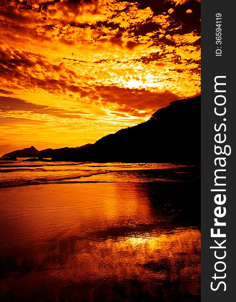 Dramatic Tropical Sunset at Lopes Mendes Beach, Ilha Grande Island, Rio de Janeiro State, Brazil. Dramatic Tropical Sunset at Lopes Mendes Beach, Ilha Grande Island, Rio de Janeiro State, Brazil.