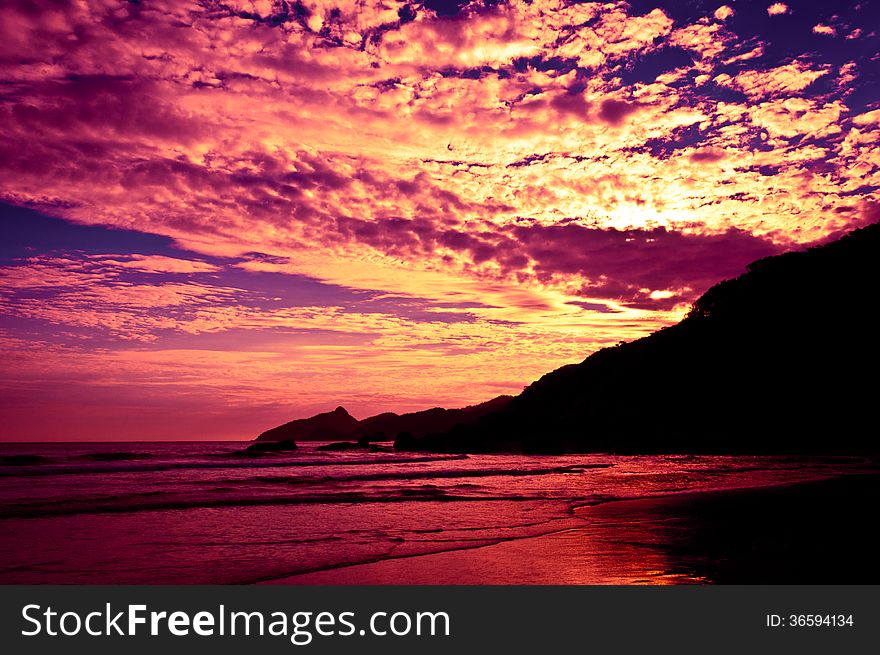 Dramatic Tropical Sunset In The Beach