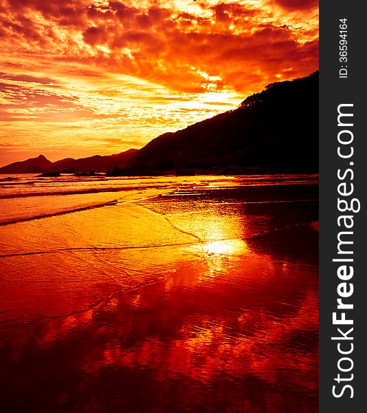 Dramatic Tropical Sunset at Lopes Mendes Beach, Ilha Grande Island, Rio de Janeiro State, Brazil. Dramatic Tropical Sunset at Lopes Mendes Beach, Ilha Grande Island, Rio de Janeiro State, Brazil.