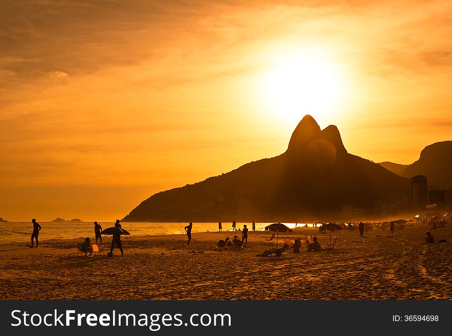 Warm Sunset on the Beach with Mountains in Horizon