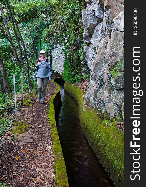 Lady Beside Levada Water Irrigation Canal. Lady Beside Levada Water Irrigation Canal