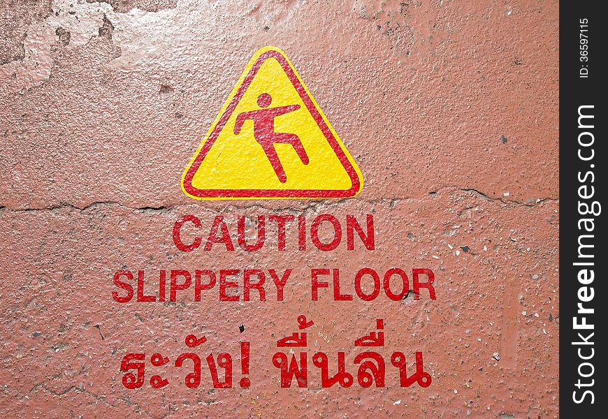 Warning sign in thai and english language at floor in golden mountain, wat sraket, Bangkok ,Thailand. Warning sign in thai and english language at floor in golden mountain, wat sraket, Bangkok ,Thailand.