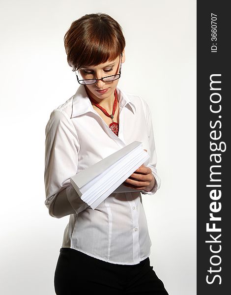 Confident young business woman on white background