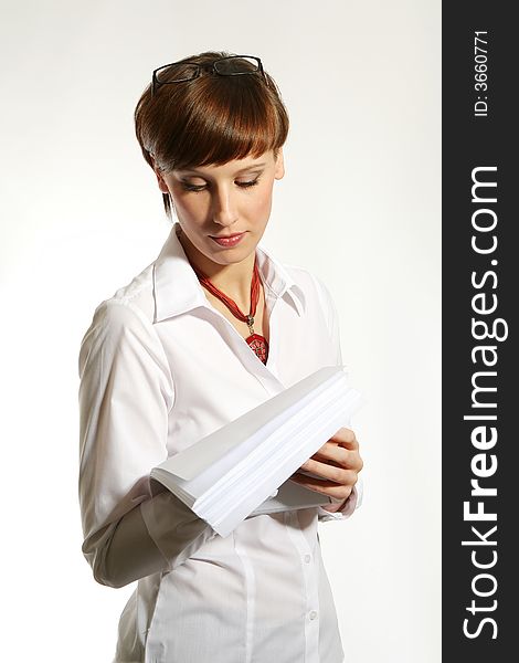 Confident young business woman on white background