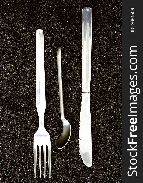 Spoon, Knife and Fork isolated in dark