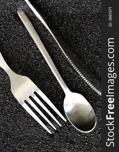 Spoon, Knife and Fork isolated in dark