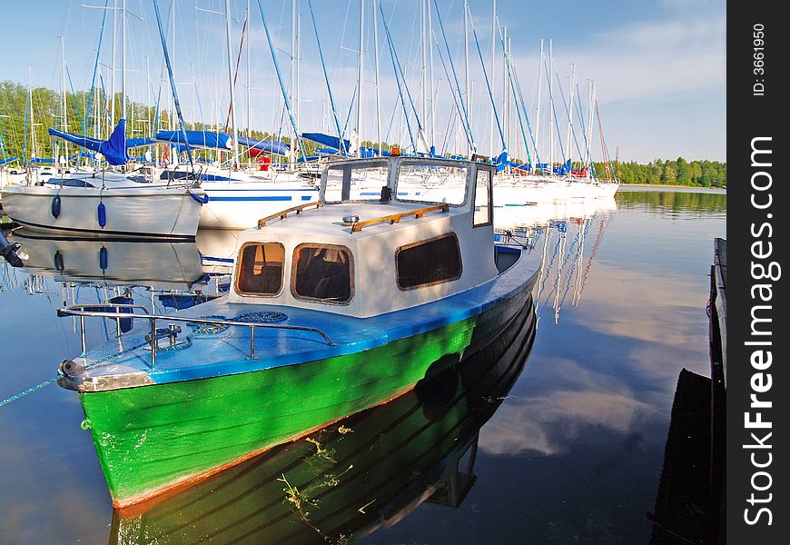 Green ship moored in Mikolajki port in Poland. Green ship moored in Mikolajki port in Poland