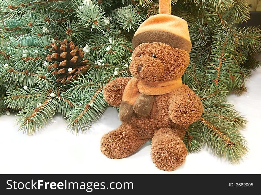 Xmas tree and teddy bear over white background