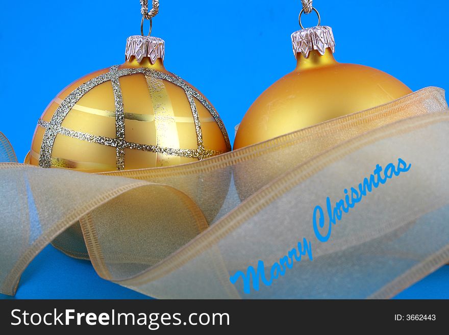 Golden decorative Christmas bauble isolated on blue backgrund. Golden decorative Christmas bauble isolated on blue backgrund