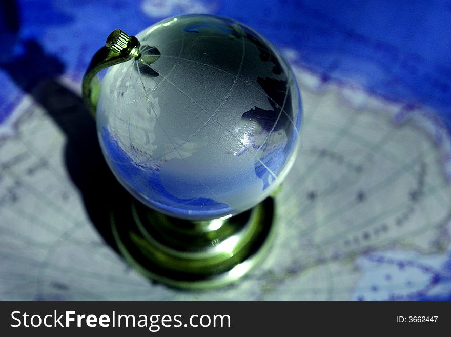 Globe on a background of a card