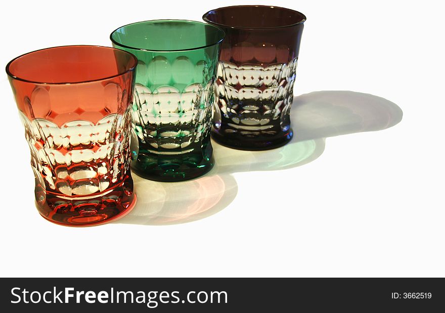 Thrree colured crystal glasses red green and violet. Thrree colured crystal glasses red green and violet