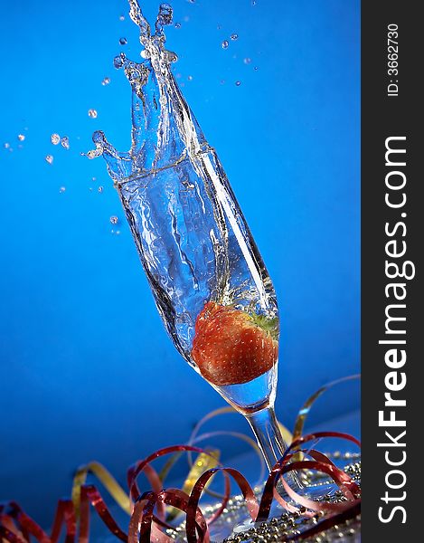 Still life with glass with champagne on the blue background