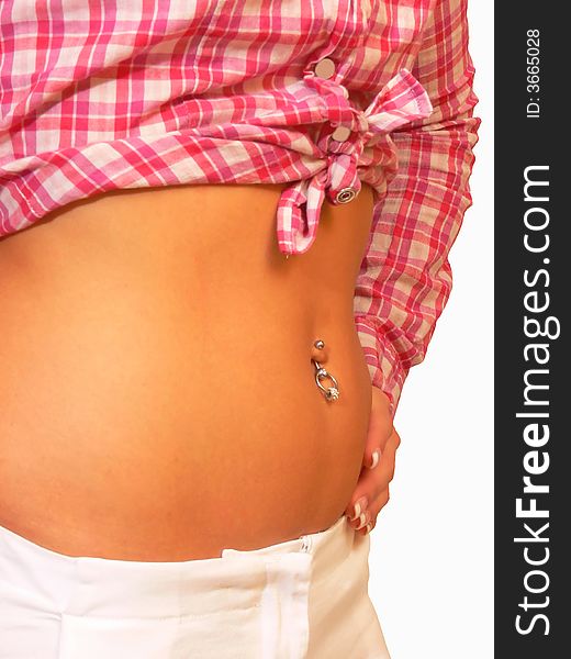 A nice diamond ring on the belly button of a young women. A nice diamond ring on the belly button of a young women.
