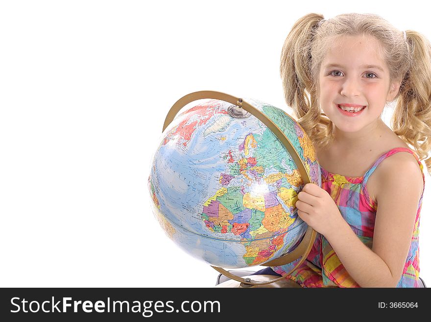 Happy little girl holding globe