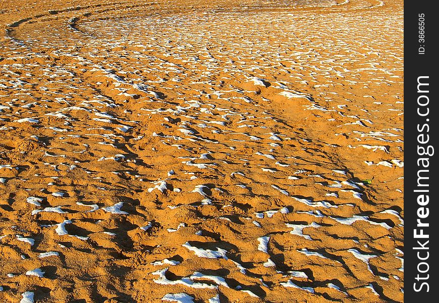 First snow on the sand beach. First snow on the sand beach.