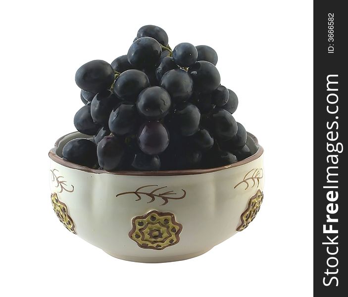 Cluster of grapes in ceramic bowl, isolated on white. Cluster of grapes in ceramic bowl, isolated on white.