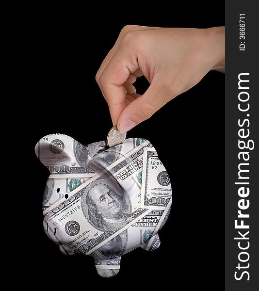 Image of piggy bank with human hand
