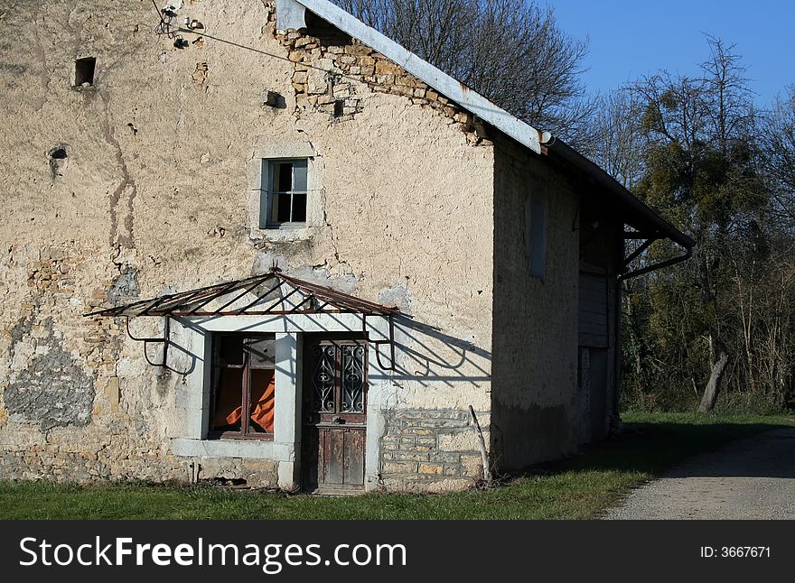 Side door of an old abandoned French farm house. Side door of an old abandoned French farm house.