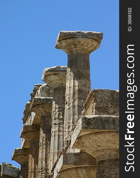 Pillars of Peastum in front of a blue sky. Pillars of Peastum in front of a blue sky