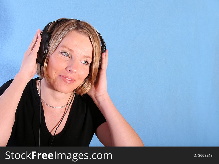 Young beautiful happy women listening music