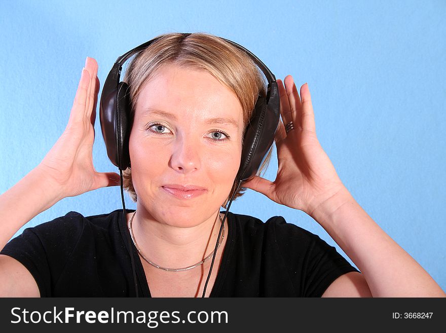 Young beautiful happy women listening music