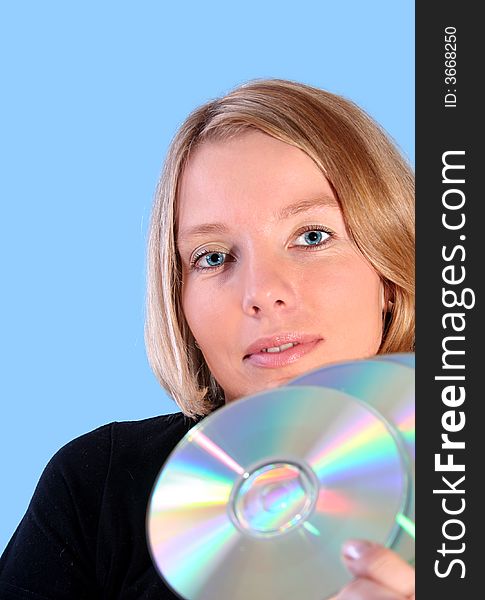 Young woman holding compact disc. Young woman holding compact disc