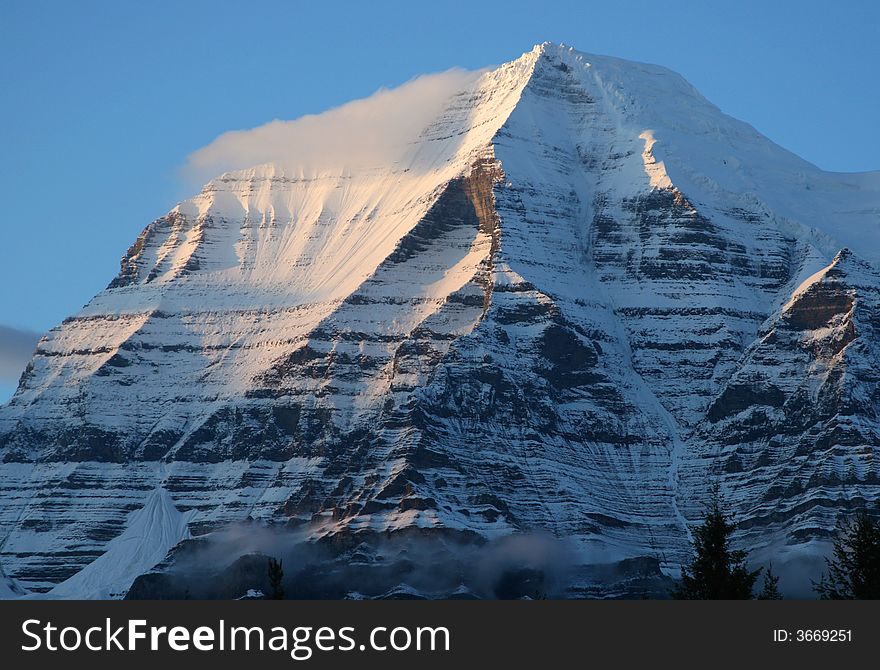 Early morning light on the summit of Mount Robson, B.C., Canada.