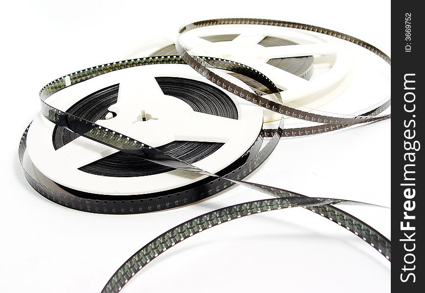 Two reels of old film strip on the white background. Two reels of old film strip on the white background