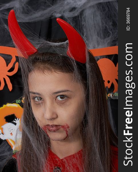A young female dressed in a halloween costume