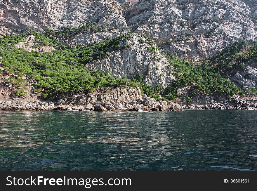 Coastal cliffs, coastline, rocky shore, the view from the sea side, Crimea peninsula, Ukraine, Black Sea Coast