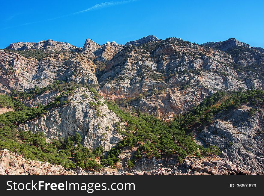 Coastal cliffs, coastline, rocky shore, the view from the sea side, Crimea peninsula, Ukraine, Black Sea Coast