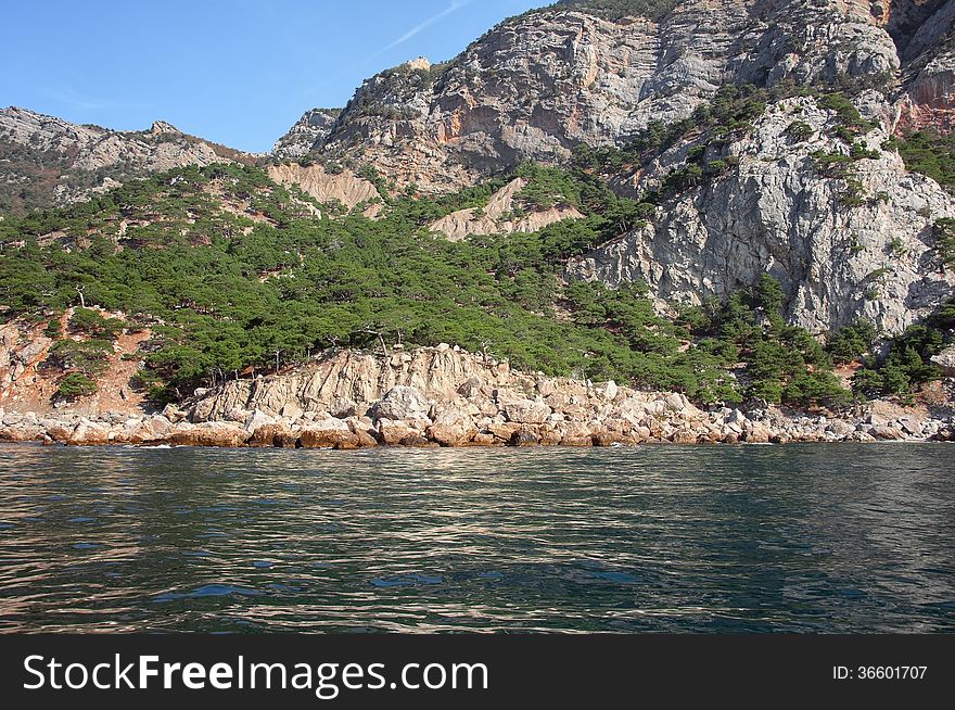 Coastal cliffs, coastline, rocky shore, the view from the sea side, Crimea peninsula, Ukraine, Black Sea Coast