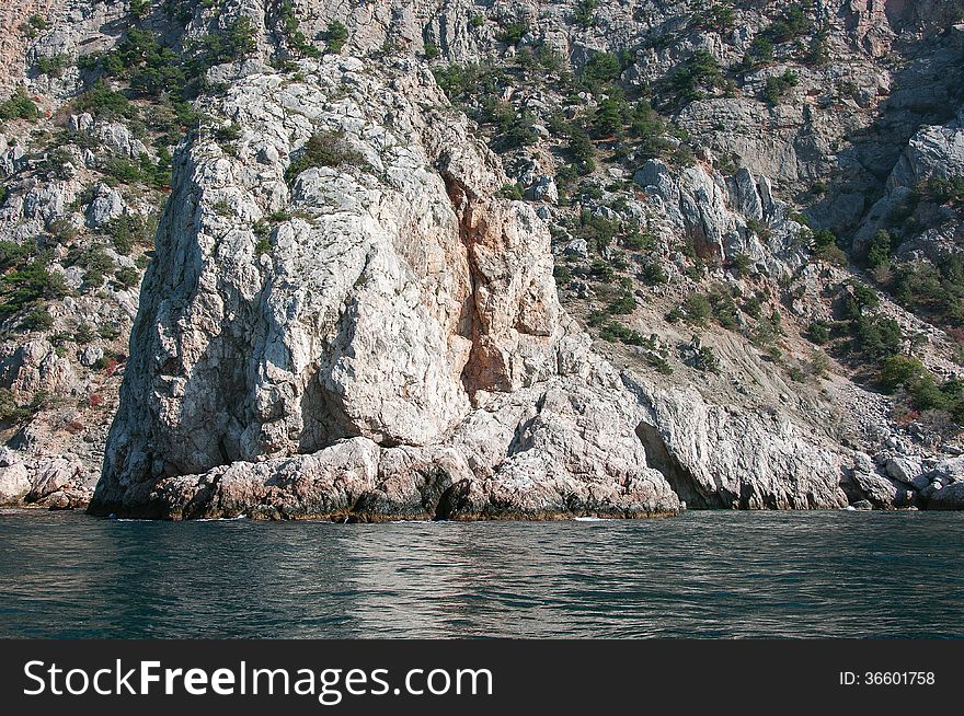 Coastal cliffs, coastline, rocky shore, the view from the sea side, Crimea peninsula, Ukraine, Black Sea Coast