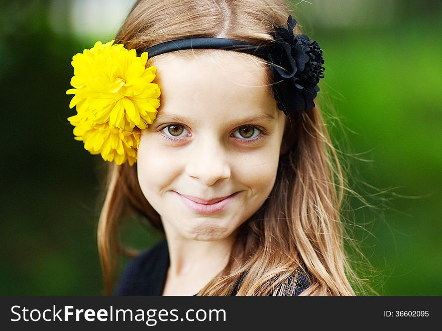 Smiling girl with flowers in her hair