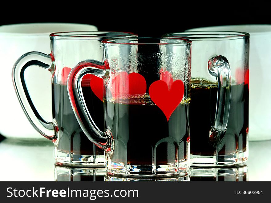 Coffee shots of whiskey in glass with hearts. Coffee shots of whiskey in glass with hearts