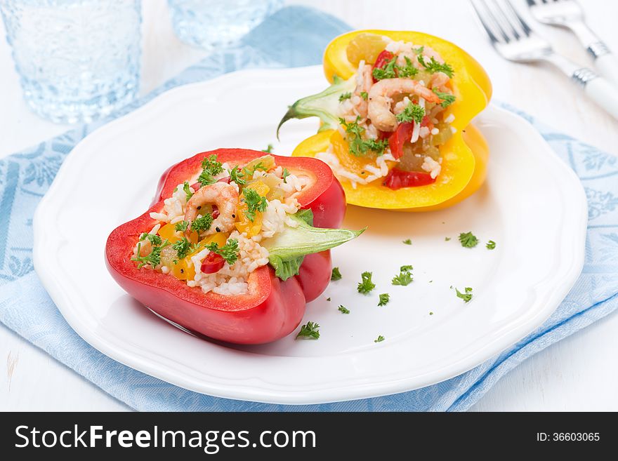 Colorful peppers stuffed with rice and shrimp, horizontal, close-up